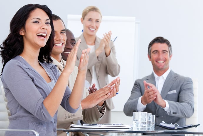 Cheerful business people applauding in a meeting. Business concept.-1