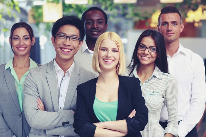 Happy group of co-workers standing in office-1